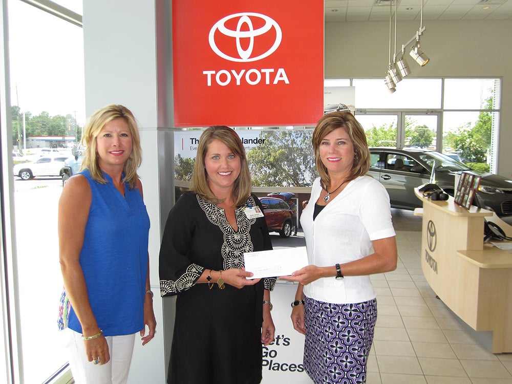 Pictured Mandy Brooks, Executive Director of TRMC Foundation (center) with Heidi Massey and Heather Stripling of Prince Toyota