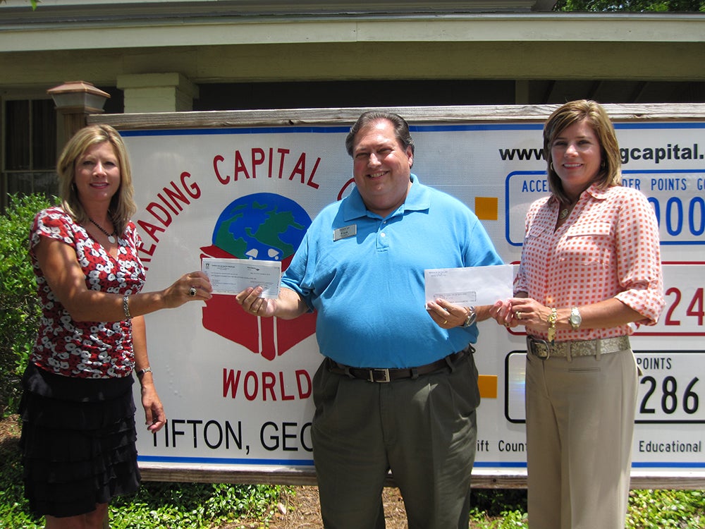 Pictured is Heidi Massey and Heather Stripling of Prince Toyota with Frank Sayles, Chair of the TCFEE